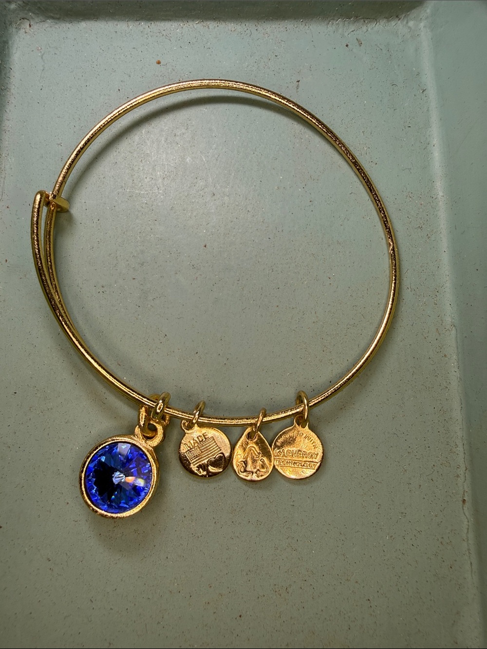 Alex and Ani Gold Tone Bracelet with Blue Crystal Charm September Birthstone